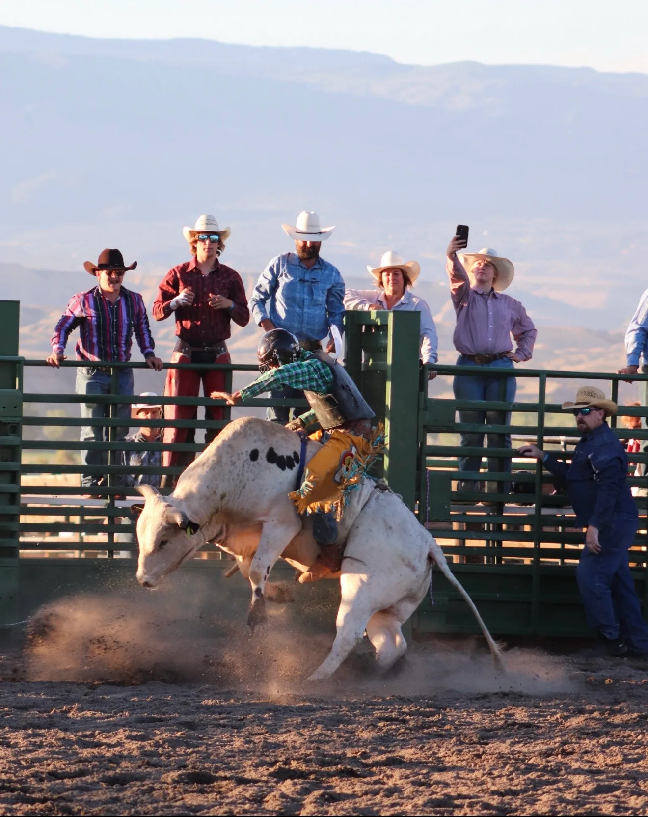 Bull rider on a white bull at Red Dirt Rampage, Grand View Event Center.